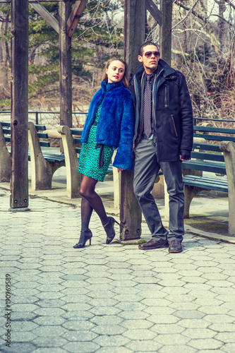 A young attractive couple are met at the park..