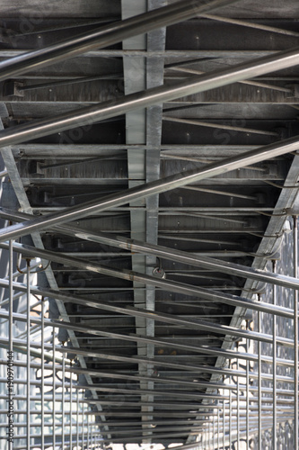 Architectural Detail of Mucem with metal pipe scaffolding and a metal walkway photographed from below. © tloventures