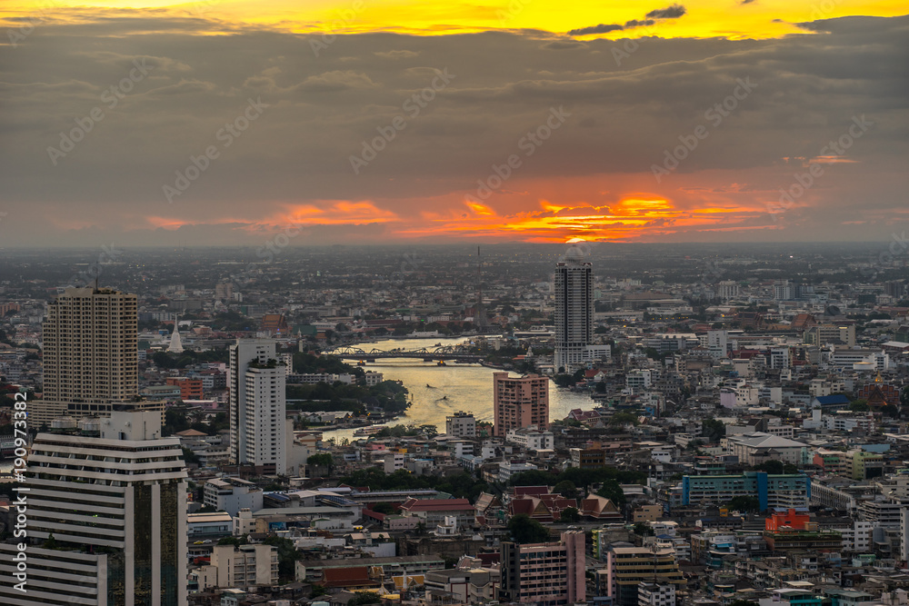 Aerial view of Chao phrayaRiver with Skyscraper. Cityscape at Twilight Time in Bangkok, Thailand.