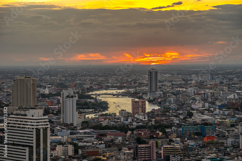 Aerial view of Chao phrayaRiver with Skyscraper. Cityscape at Twilight Time in Bangkok  Thailand.