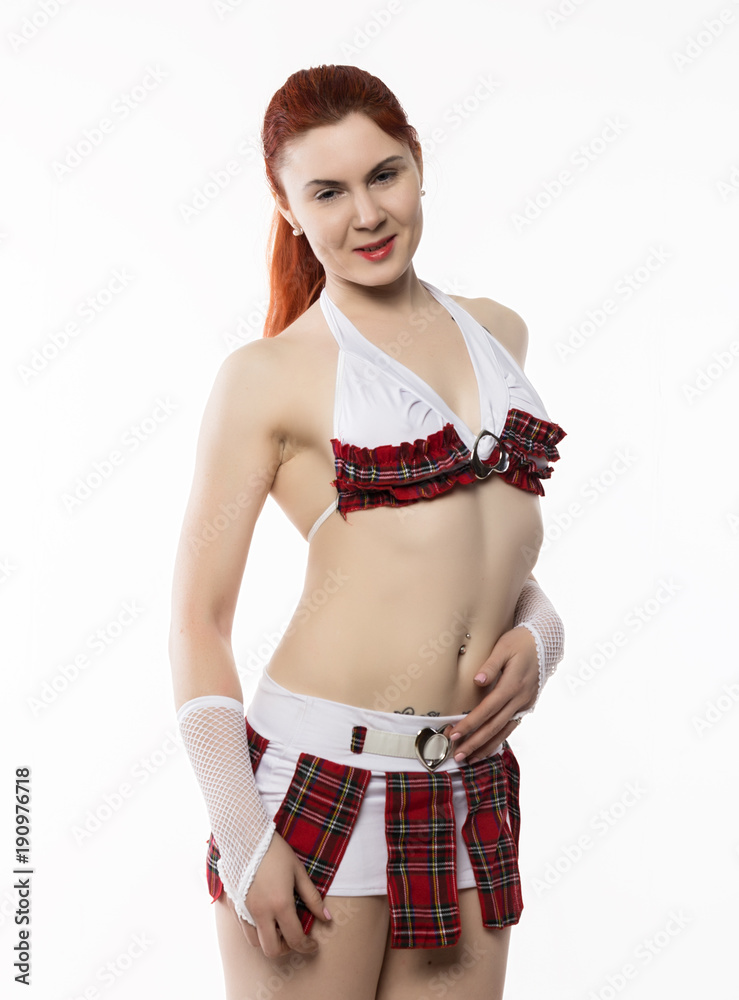 young sexy striptease dancer in a miniskirt on a light background Stock  Photo | Adobe Stock