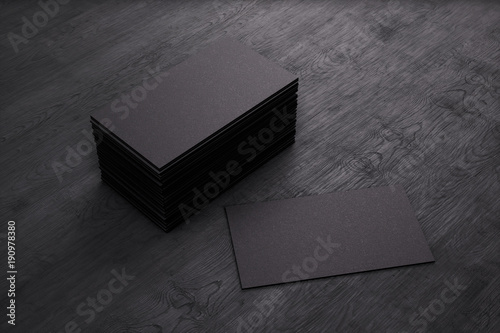 Blank template black Business Cards on black wooden background. 3D rendering.