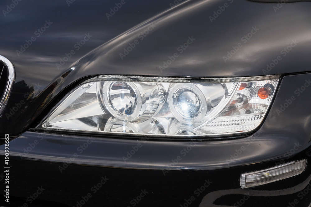 自動車のヘッドライト　Headlight of the car - obrazy, fototapety, plakaty 