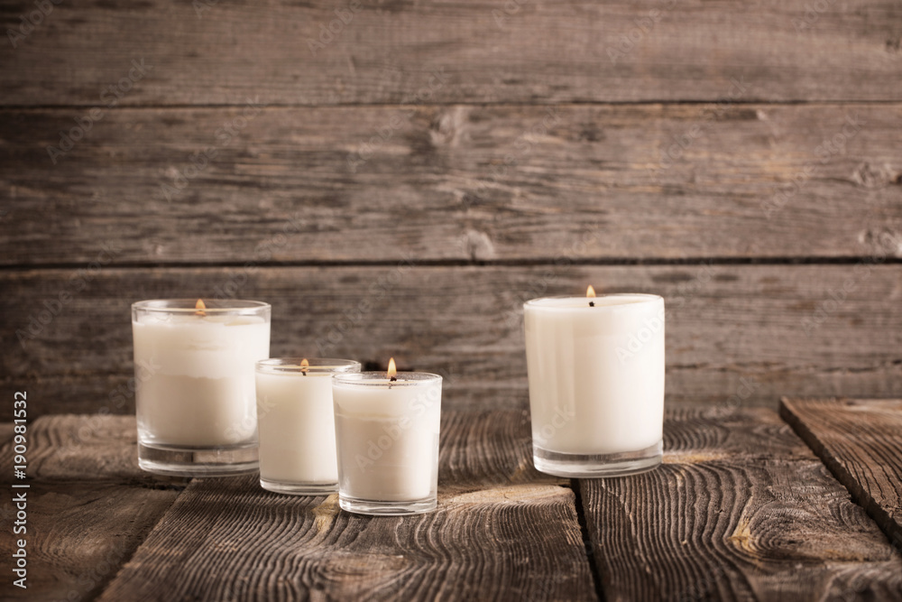 candles on old wooden background candles on old wooden background