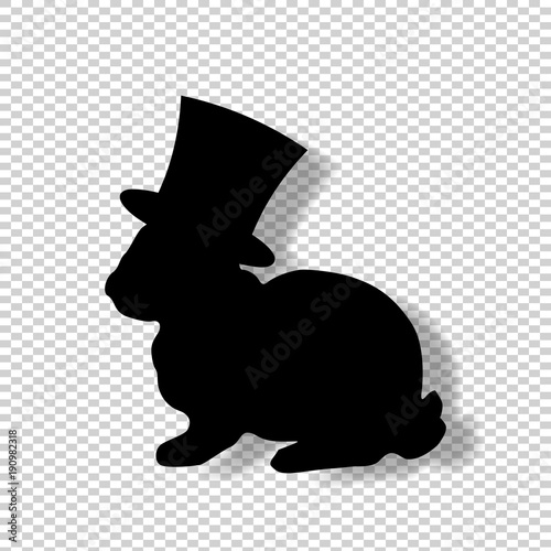 Black profile silhouette of fluffy rabbit in magic top hat