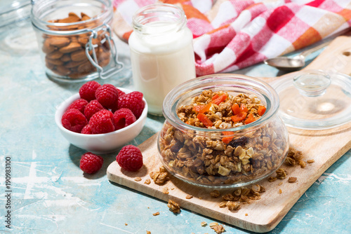 homemade granola with dried apricots and nuts in a jar for breakfast