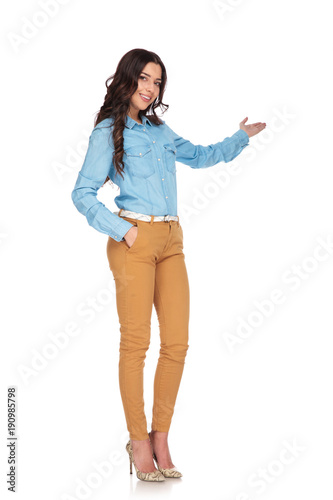 full body picture of a young casual woman presenting