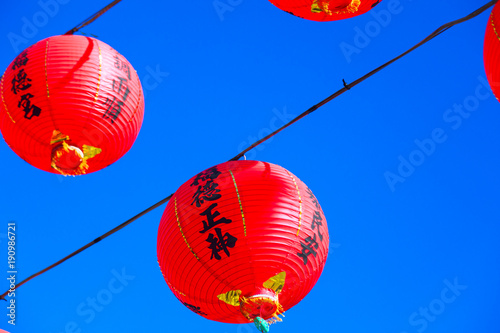 Chinese temple traditional decoration, red oriental lantern, which says good weather(Lantern text is,God's name and temple's name)