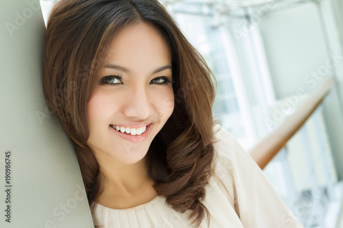 happy smiling positive asian caucasian business woman portrait
