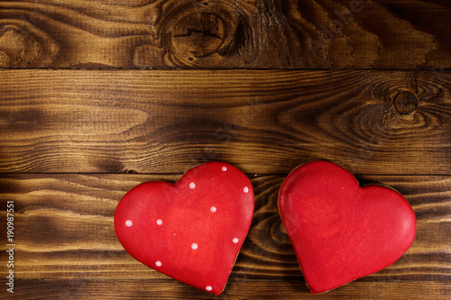 Heart shaped cookies for valentine day on wooden table. Top view