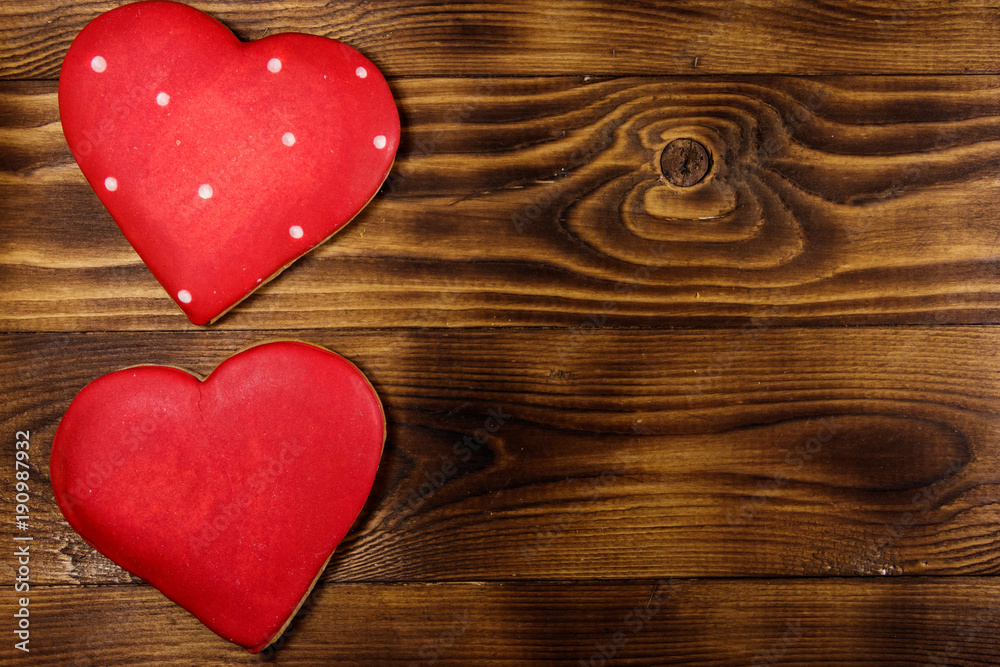 Heart shaped cookies for valentine day on wooden table. Top view Heart shaped cookies for valentine day on wooden table. Top view