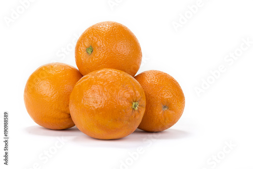 Fresh juicy oranges with halves on the white background