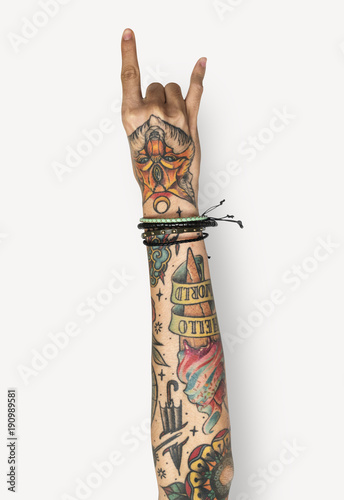 Hand with tattoo raised up