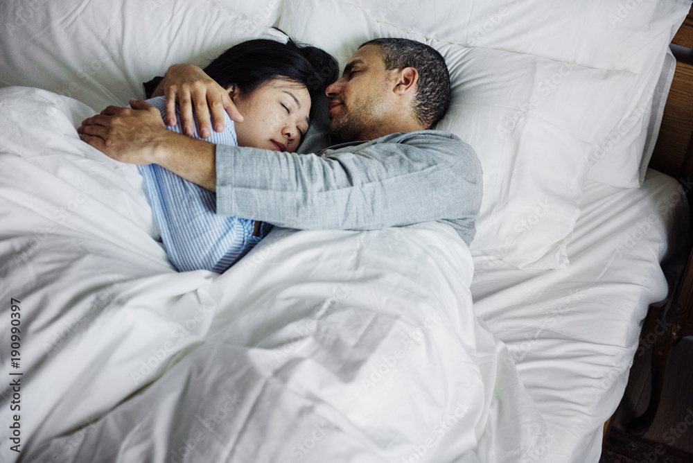 Couple hugging on a bed Couple hugging on a bed