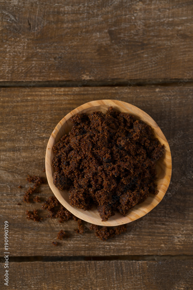 molasses sugar on wooden surface molasses sugar on wooden surface