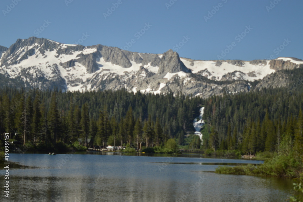 Snow Spotted Mountain over a Lake