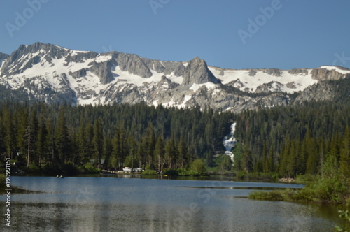 Fototapeta Naklejka Na Ścianę i Meble -  Snow Spotted Mountain over a Lake