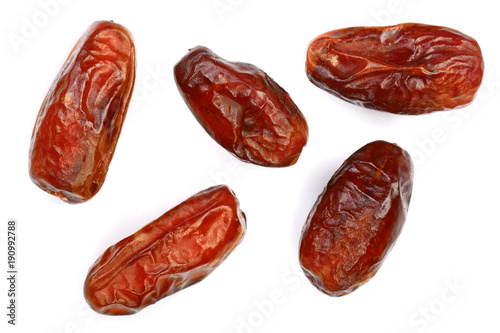 dry dates isolated on white background. Top view. Flat lay pattern photo