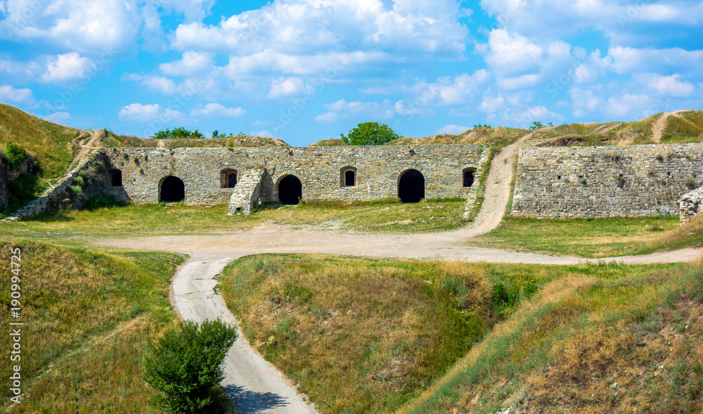 Photo of ancient stone ruins with many doors in Kamyanets-Podilsky