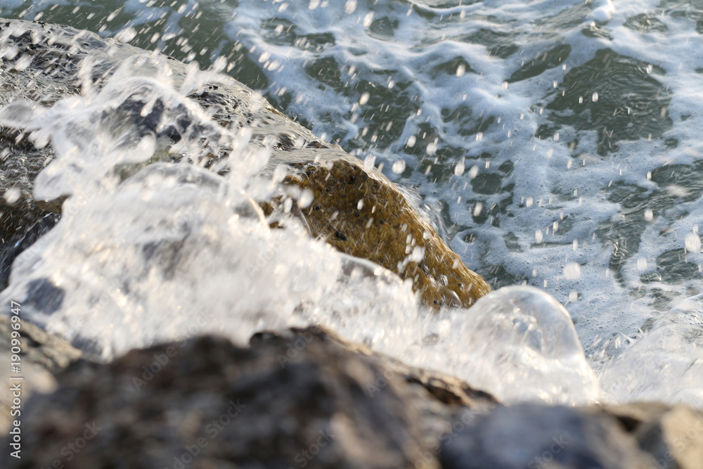 ocean waves crashing on the rocks, slow shutter speed shot for water movement ocean waves crashing on the rocks, slow shutter speed shot for water movement