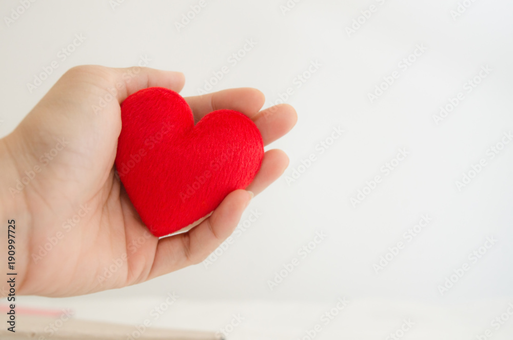 Red heart in hand isolated white background. Red heart in hand isolated white background.