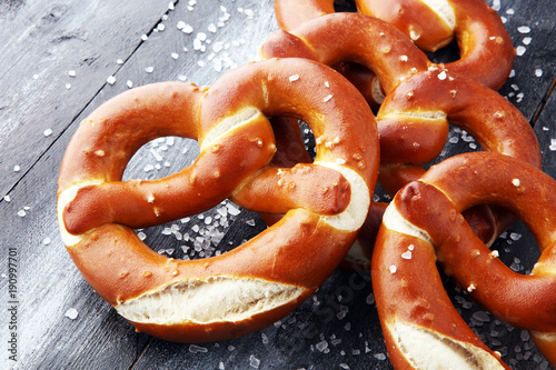 Tela German pretzels with salt close-up on the table.