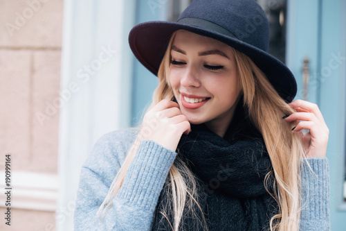 Positive fashion shine smiling girl enjoy life,laughing.Close-up portrait of beautiful caucasian woman with charming smile walking outdoors.Copy space.