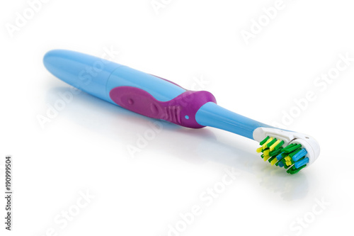 Standard electric toothbrush closeup at selective focus