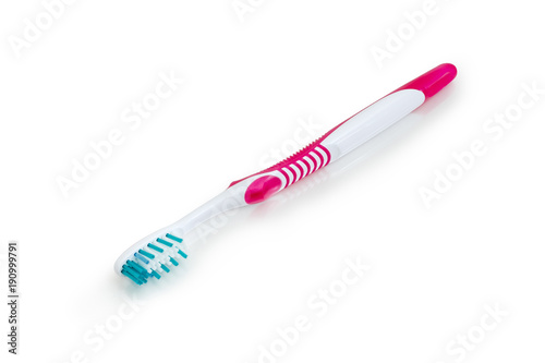 Toothbrush on a white matte surface closeup