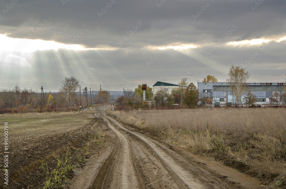 Scene with rural road, factory and field