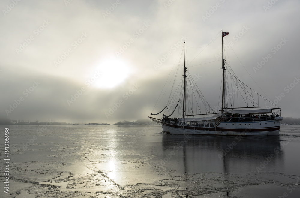 Fototapeta premium Sailing ship in foggy sea landscape