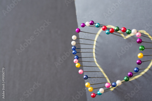 Heart shape from colored pins.