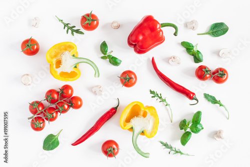Healthy food on white background. Vegetables, tomatoes, peppers, green leaves, mushrooms. Flat lay, top view