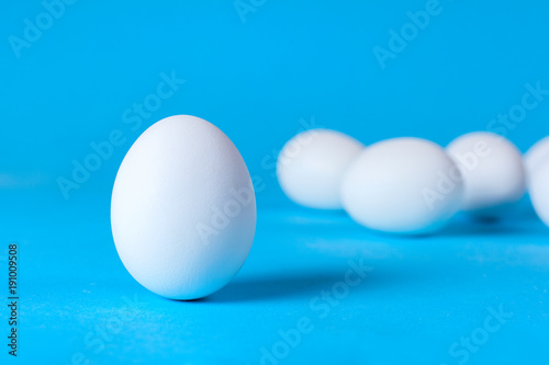 White eggs on a blue background. A good hearty breakfast of boiled eggs