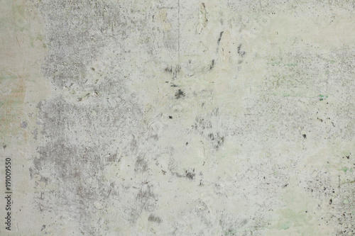 Old gray concrete wall with scuffs and putty green primer, texture background