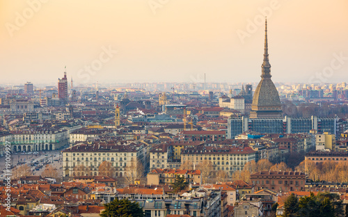 Turin cityscape, Torino, Italy at sunset, panorama with the Mole Antonelliana over the city. Scenic colorful light and dramatic sky.