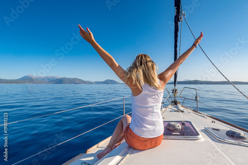 Beautifull young woman on a yacht at sea