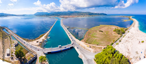 Aerial panorama of Lefkada swing bridge and harbour canal and the longest beach on the island photo