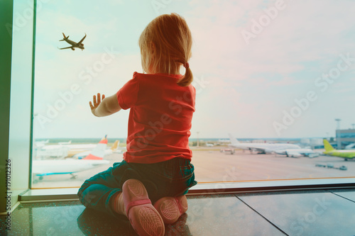 little girl waiting in airport, family travel