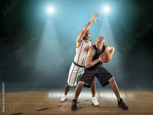 Caucassian Basketball Player in dynamic action with ball in a pr