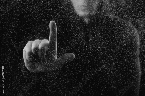 cropped shot of person touching frosted glass with finger photo