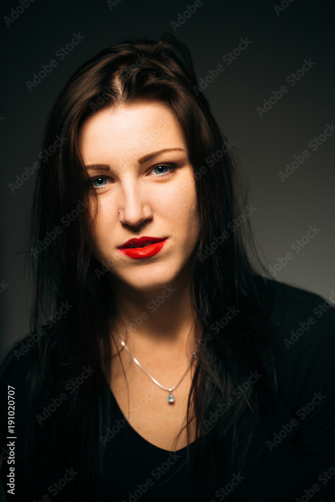 emotional girl smiling on a dark background
