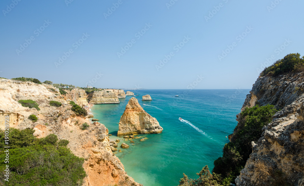 Views of golden cliffs and the Atlantic ocean from the observation deck. District Faro, Algarve, Southern Portugal