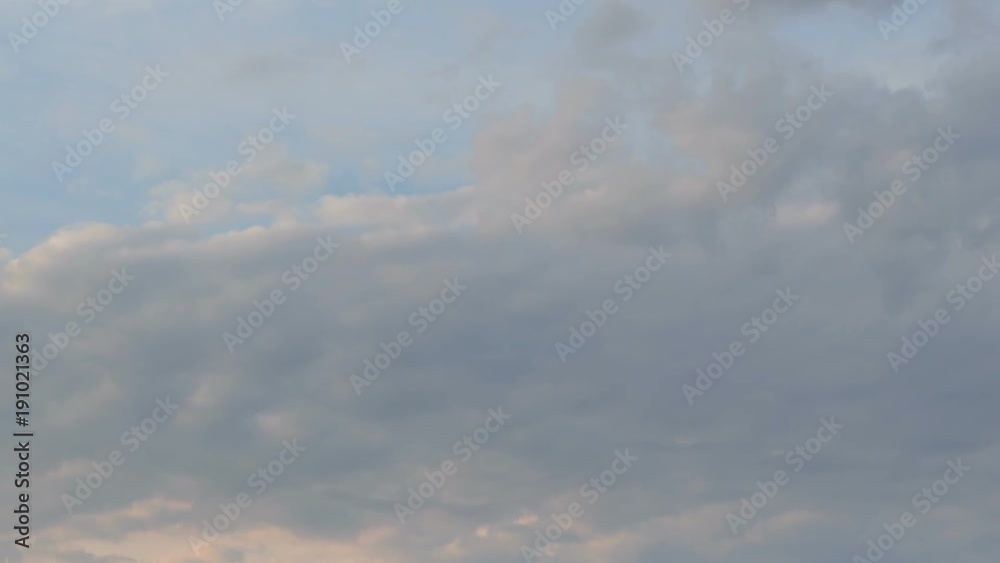 Russia, time lapse. Formation and rapid movement of white clouds of different shapes in the blue sky in late spring at sunset. Russia, time lapse. Formation and rapid movement of white clouds of different shapes in the blue sky in late spring at sunset.
