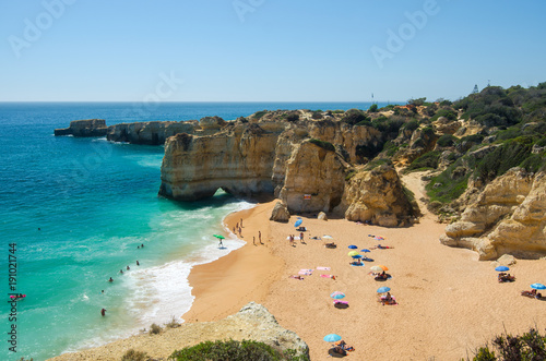 View of limestone cliffs and the Rabbit Beach (Praia da Coelha) in Albufeira, District Faro, Algarve, Southern Portugal photo
