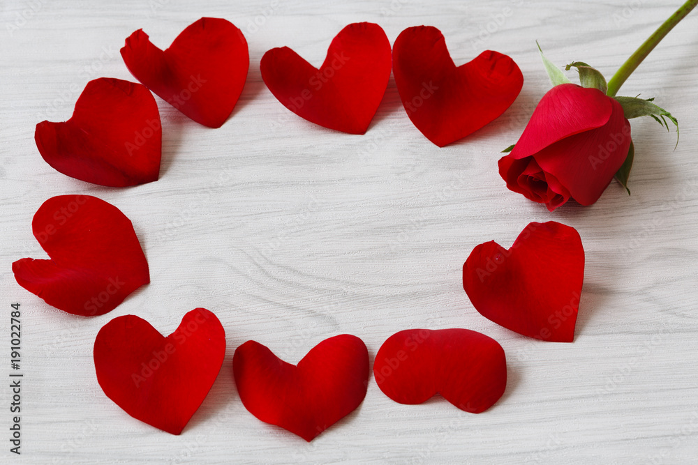 heart shaped rose petals and woody background heart shaped rose petals and woody background