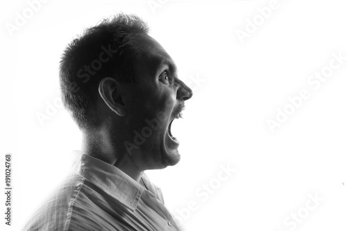 Screaming male person silhouette,back lit light
