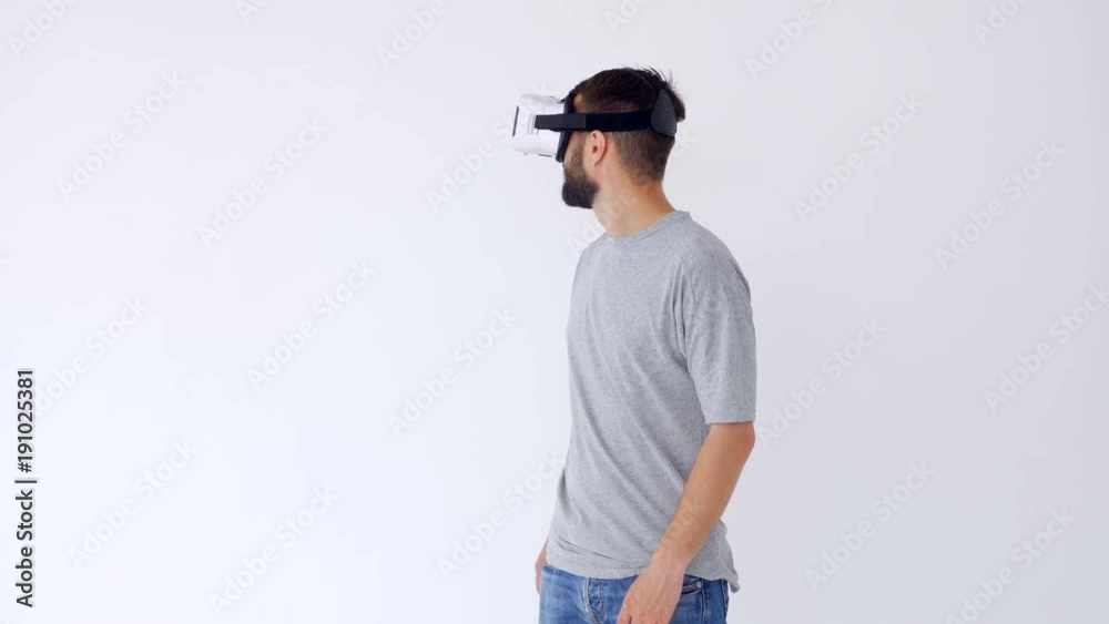 Bearded man with VR glasses looking around Bearded man with VR glasses looking around