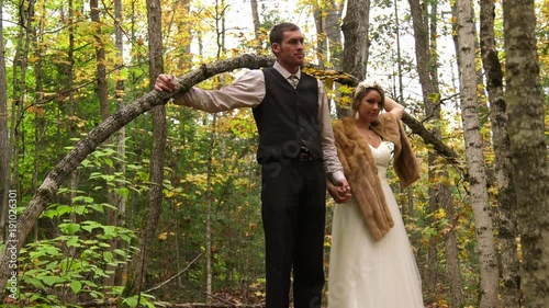 newly married couple posing in the forest for photo 4k photo