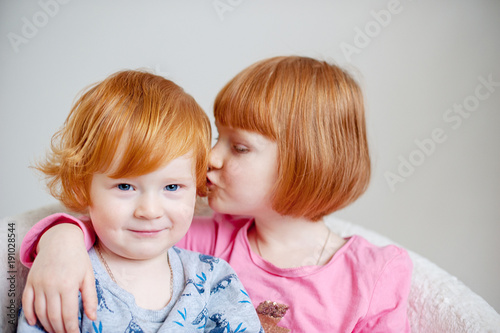 Red-haired brother and sister share a secret